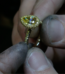 custom halo engagement ring with yellow diamonds